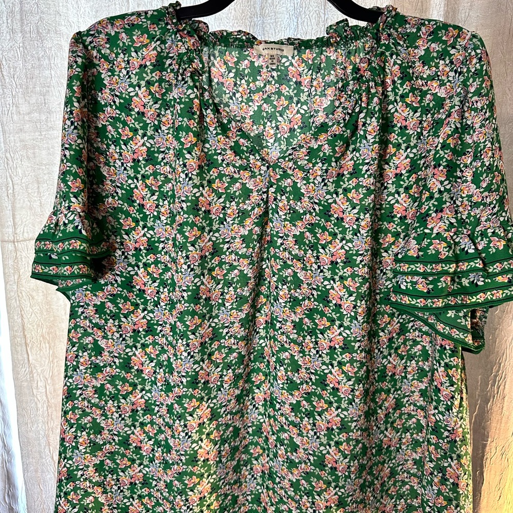 Green and pink short sleeved blouse